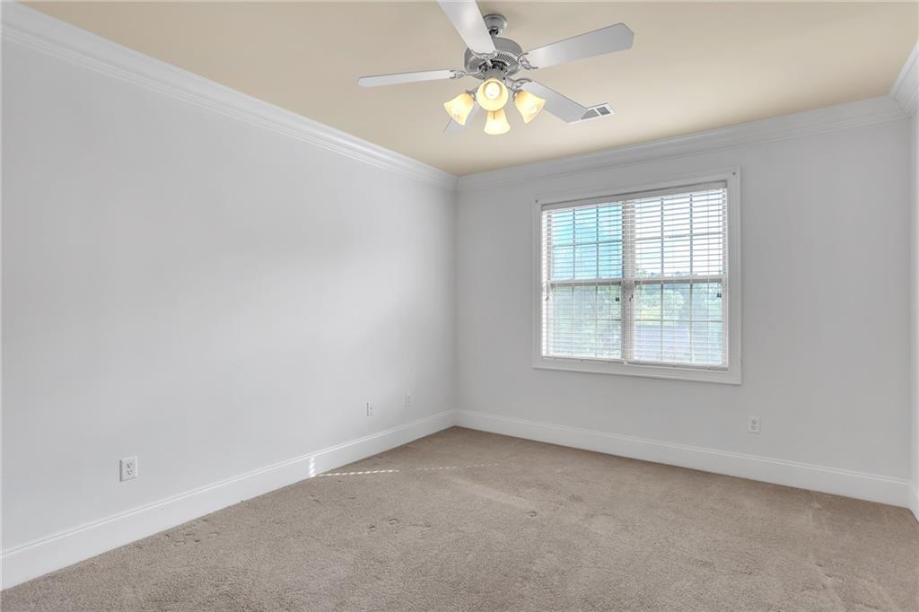 2300 Peachford Road, Unit 1209 Atlanta, GA 30338 - Photo 16 of 31 an empty room with a window and a fan