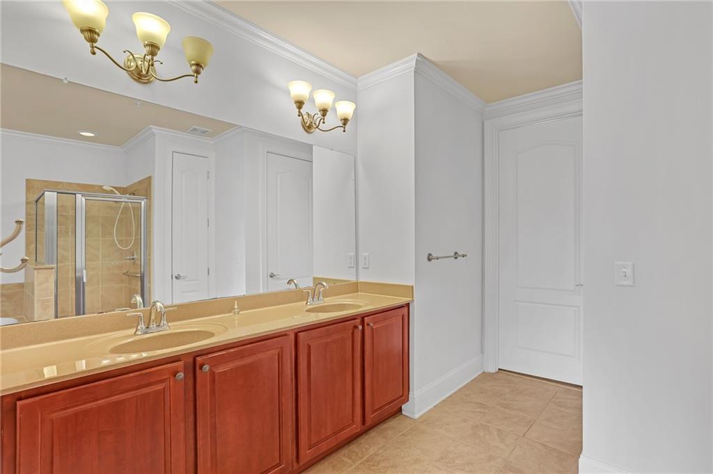 2300 Peachford Road, Unit 1209 Atlanta, GA 30338 - Photo 18 of 31 a bathroom with a sink and a mirror