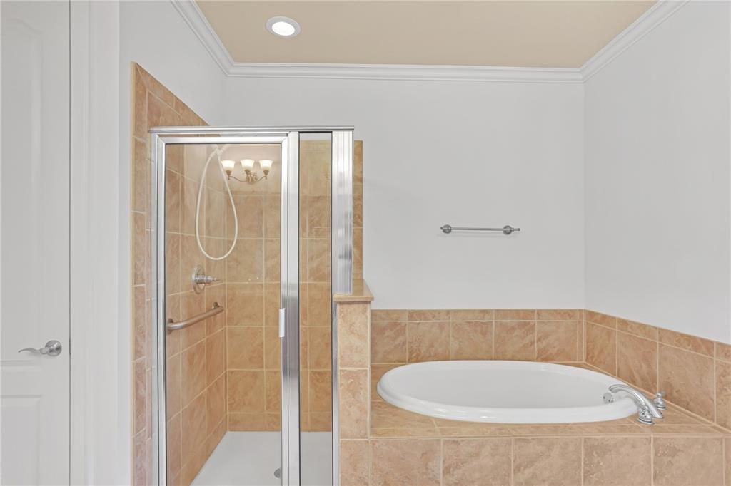 2300 Peachford Road, Unit 1209 Atlanta, GA 30338 - Photo 19 of 31 a bathroom with a tub and shower