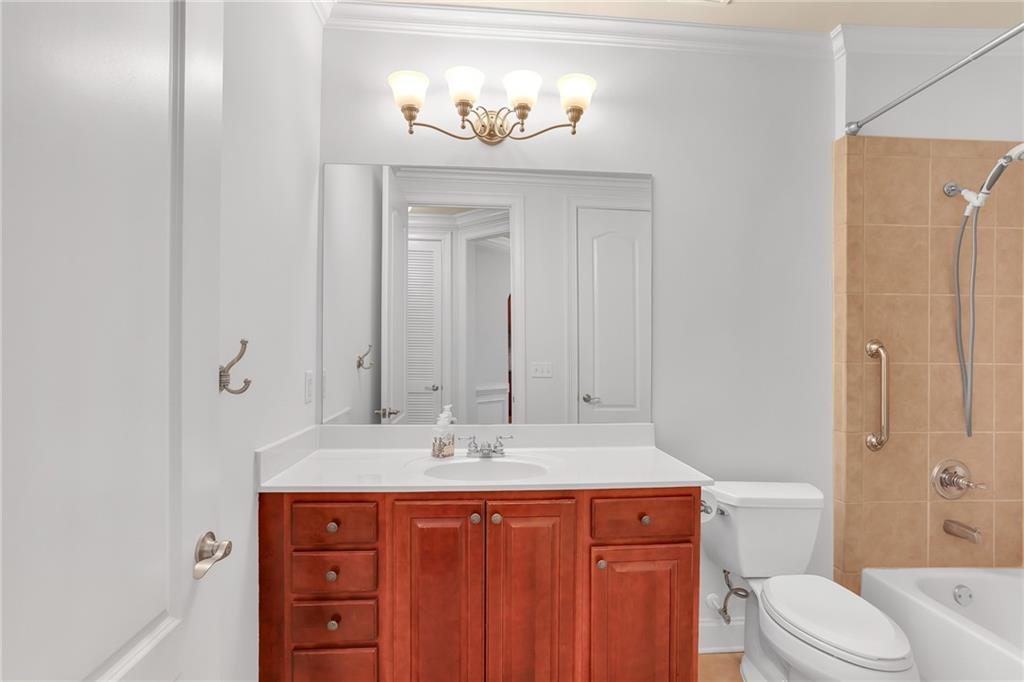 2300 Peachford Road, Unit 1209 Atlanta, GA 30338 - Photo 24 of 31 a bathroom with a sink and a toilet