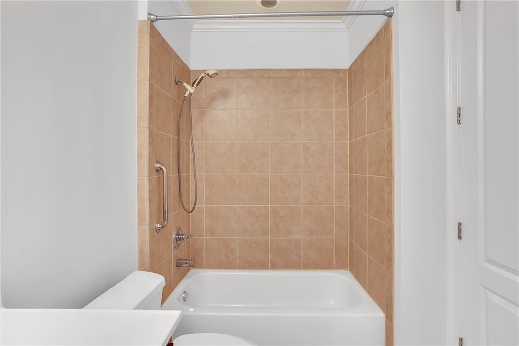 2300 Peachford Road, Unit 1209 Atlanta, GA 30338 - Photo 25 of 31 a bathroom with a bathtub and a shower