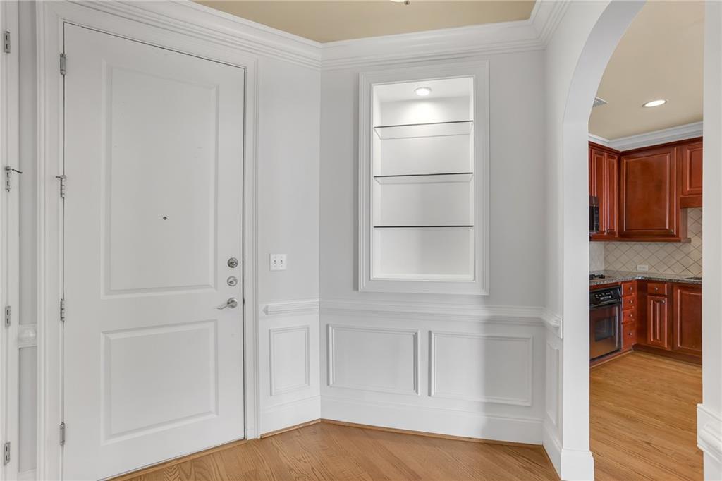 2300 Peachford Road, Unit 1209 Atlanta, GA 30338 - Photo 28 of 31 a view of a room with a closet and wooden floor