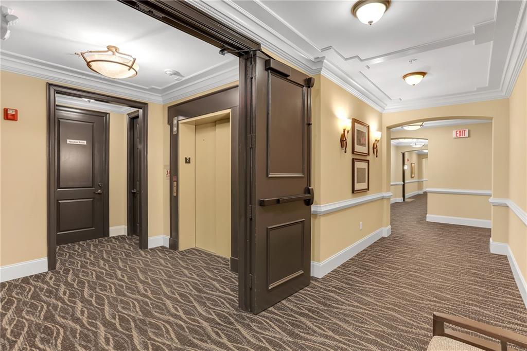 2300 Peachford Road, Unit 1209 Atlanta, GA 30338 - Photo 29 of 31 a view of a hallway with wooden floor