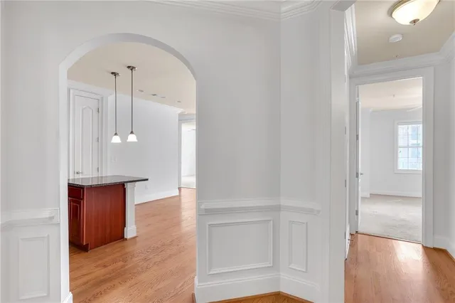 a kitchen with stainless steel appliances granite countertop a sink a stove and a microwave