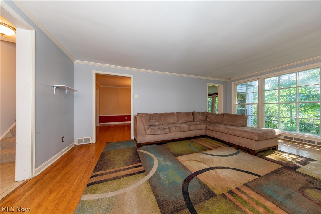 2046 Temblethurst Road South Euclid, OH 44121 - Photo 5 of 35 The spacious Living Room with large rear window offers a serene and panoramic view of the rear wooded garden