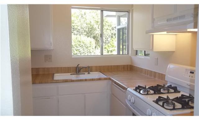 1448 Panorama Ridge Road Oceanside, CA 92056 - Photo 4 of 25 The Kitchen has been freshly painted and includes a new range & vent hood.