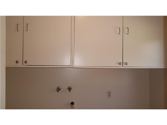 1448 Panorama Ridge Road Oceanside, CA 92056 - Photo 8 of 25 There are additional cabinets above the washer & dryer area for even more storage.