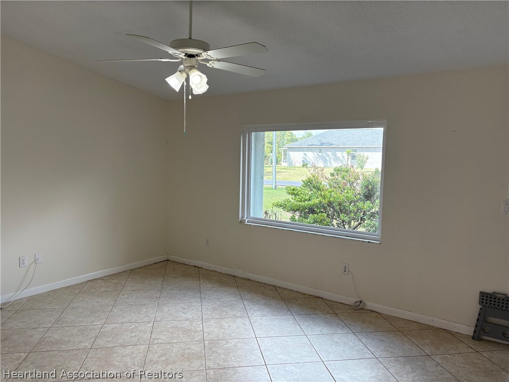 3913 Ferrari Drive Sebring, FL 33872 - Photo 4 of 20 a view of an empty room with a window