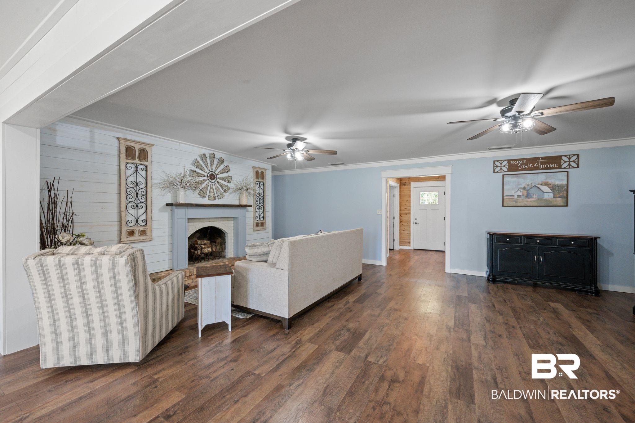 20037 County Road 33 Fairhope, AL 36532 - Photo 8 of 79 Living room with dark wood-type flooring, crown molding, and ceiling fan
