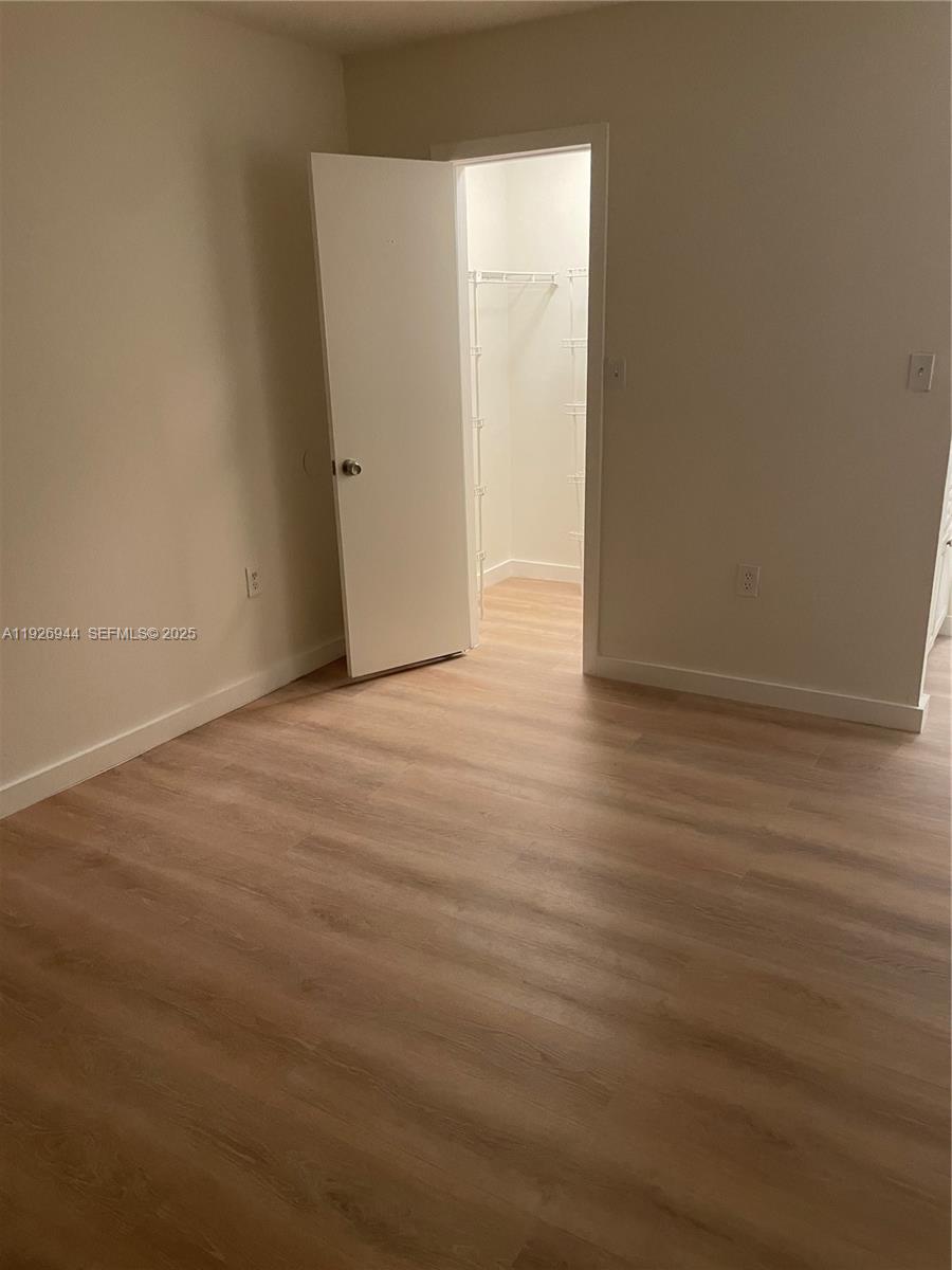 2179 Southwest 80th Terrace Miramar, FL 33025 - Photo 3 of 14 a view of an empty room with wooden floor