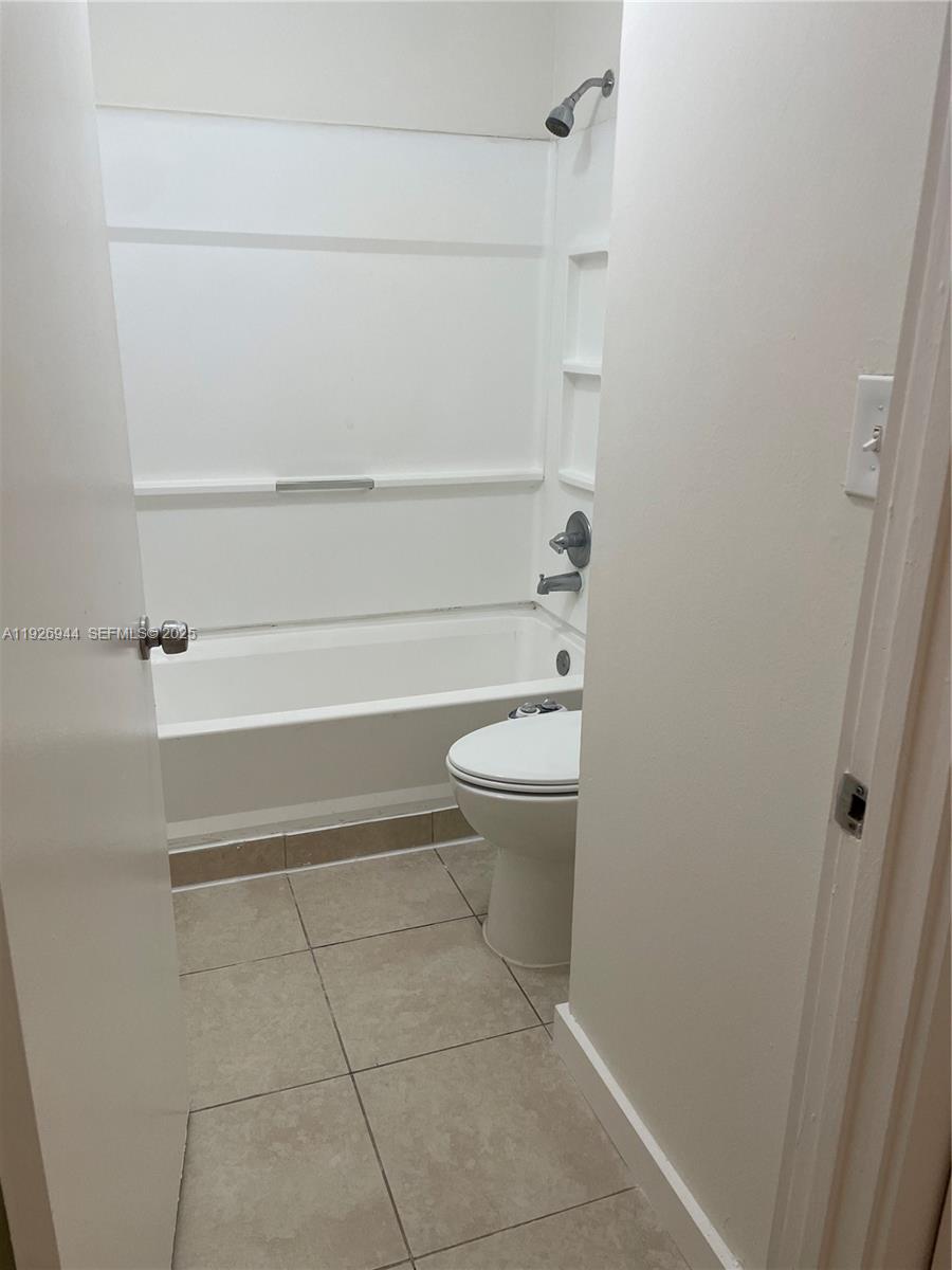 2179 Southwest 80th Terrace Miramar, FL 33025 - Photo 5 of 14 a bathroom with a toilet and a shower