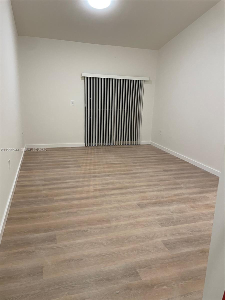 2179 Southwest 80th Terrace Miramar, FL 33025 - Photo 9 of 14 a view of a room with wooden floor