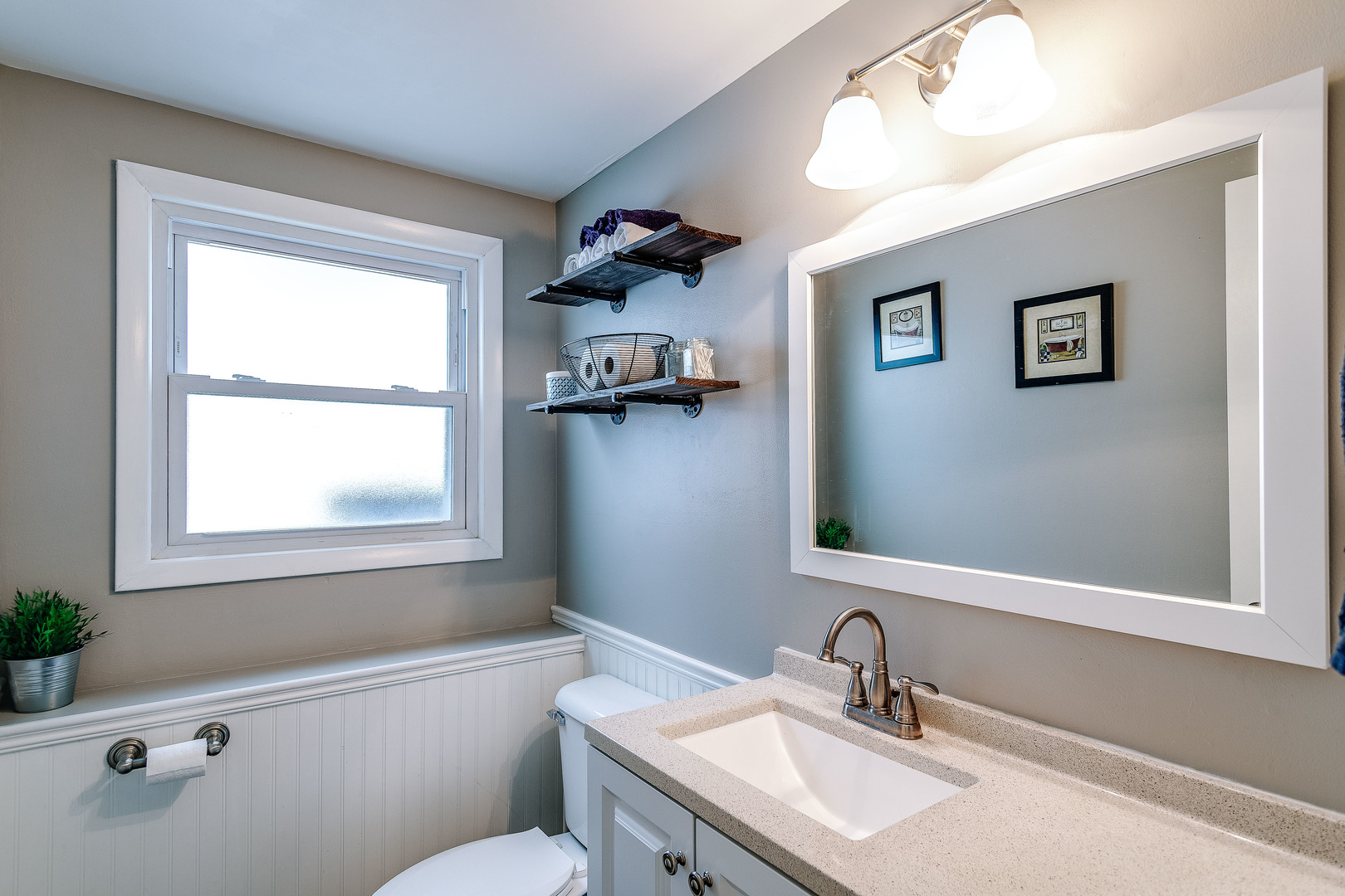 26-w068 Jewell Road Wheaton, IL 60187 - Photo 17 of 25 a bathroom with a sink a toilet and a mirror