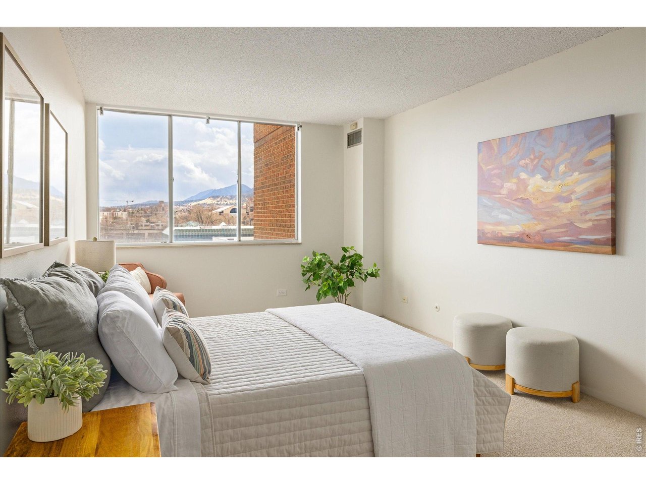 1850 Folsom Street, Unit 503 Boulder, CO 80302 - Photo 11 of 22 a bedroom with a bed and wooden floor