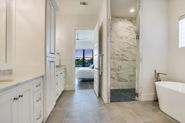 a bathroom with a bathtub and a sink
