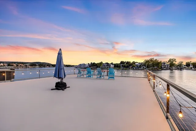 a view of street next to a lake