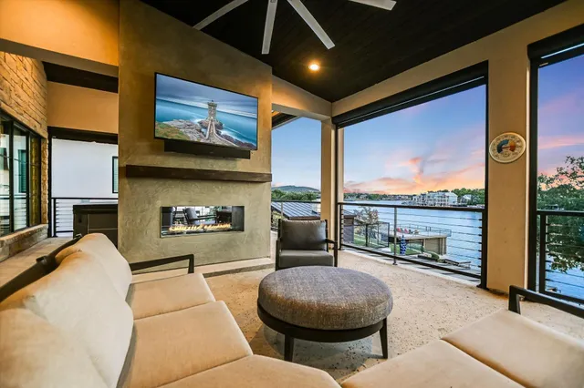 a view of a balcony with lake view and a couches
