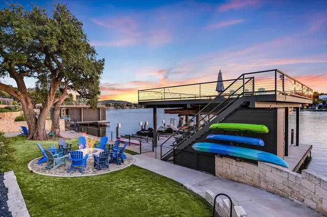 an aerial view of a house with a lake view