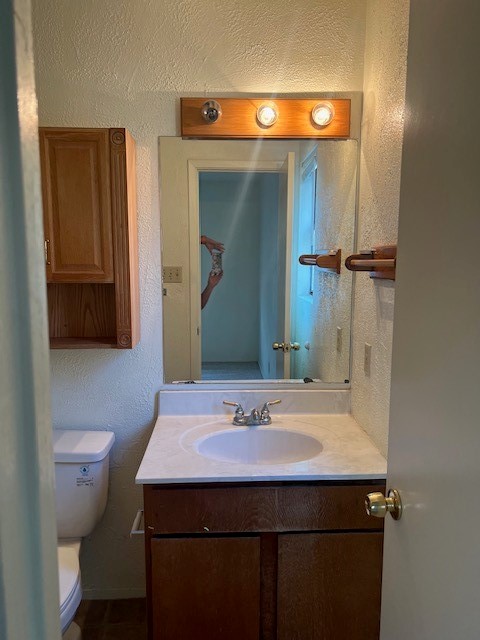 112 Verna Spur, Unit B Georgetown, TX 78628 - Photo 15 of 23 a bathroom with a sink and a mirror