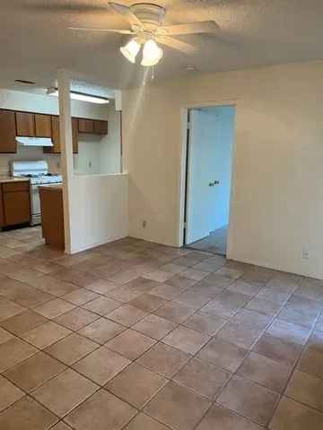 a view of a kitchen with kitchen and granite countertop a sink