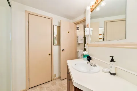 a bathroom with a sink and a mirror