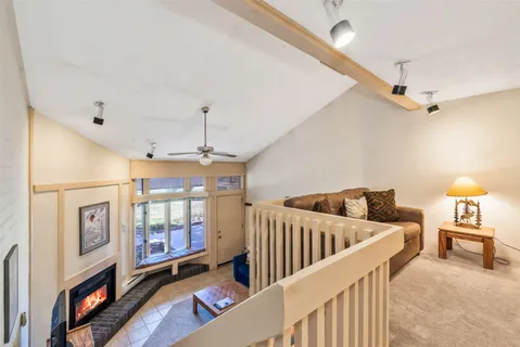 a view of a livingroom with furniture and hardwood floor