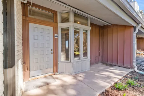 a view of a swimming pool with a yard