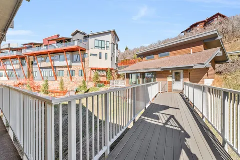 a view of a patio with a table and chairs