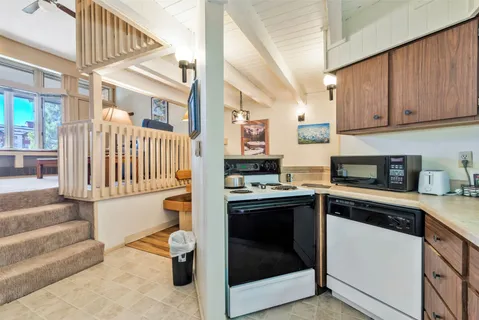 a kitchen with stainless steel appliances granite countertop a stove and a refrigerator