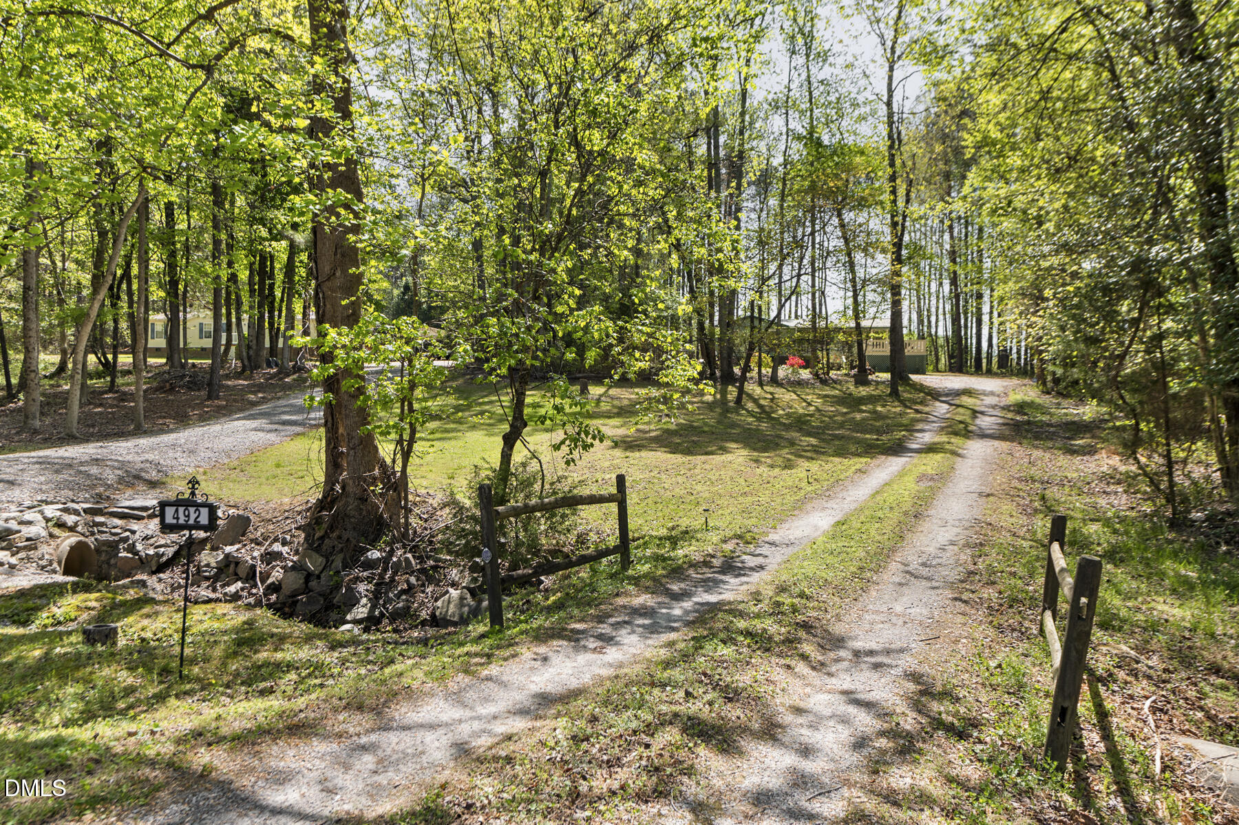 492 Little Mill Road Henderson, NC 27537 - Photo 32 of 39 a view of a yard with large trees