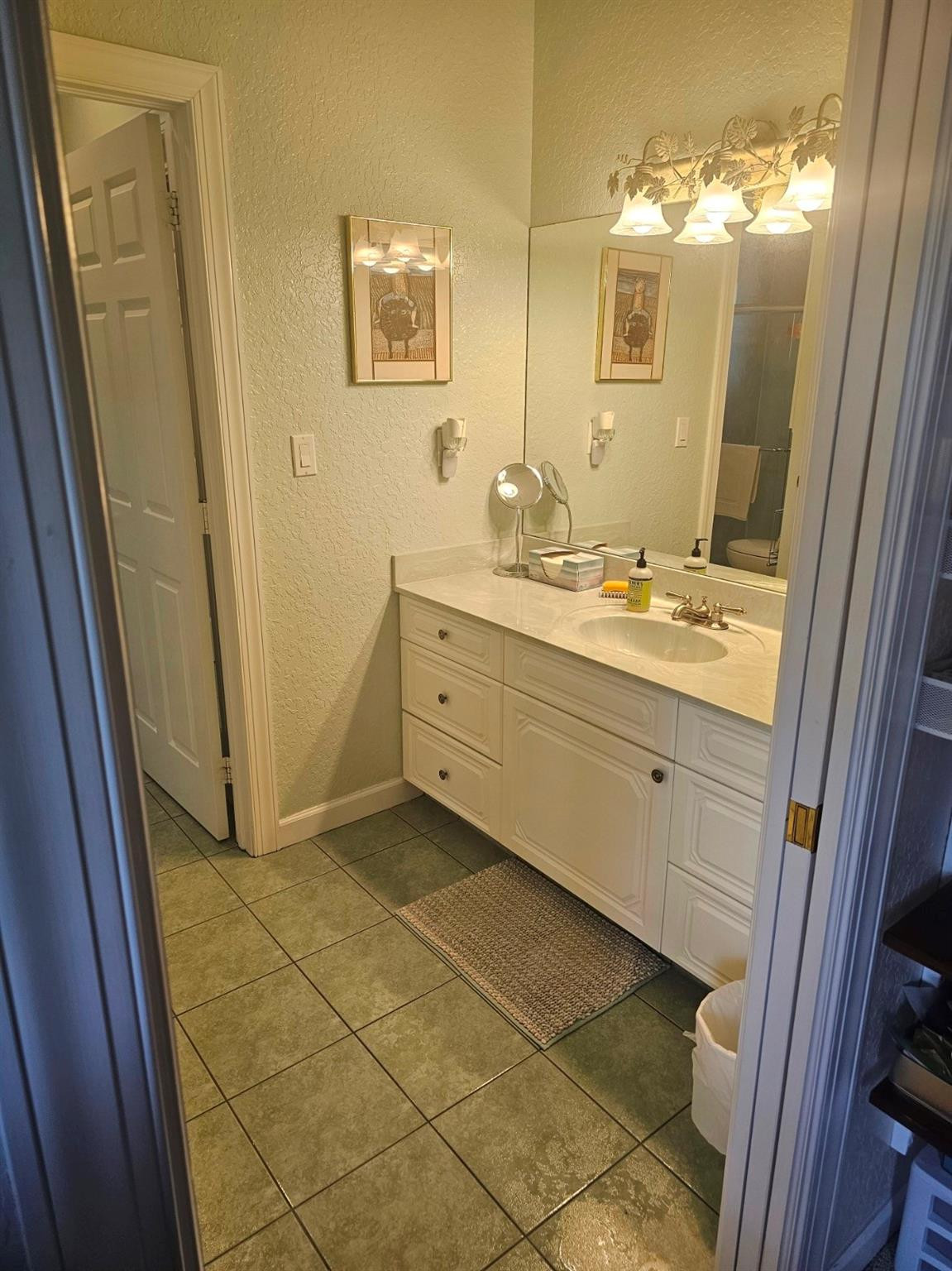 6963 Wilson Road West Palm Beach, FL 33413 - Photo 16 of 29 a bathroom with a mirror sink and vanity