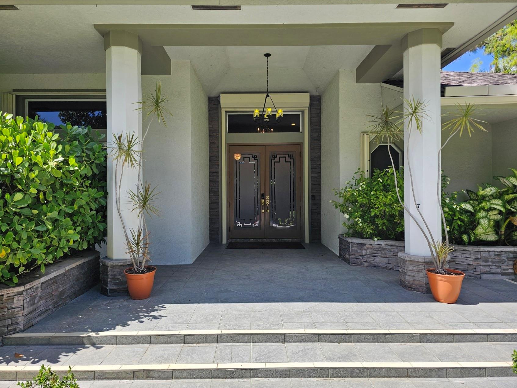 6963 Wilson Road West Palm Beach, FL 33413 - Photo 2 of 29 a view of a entrance door of the house