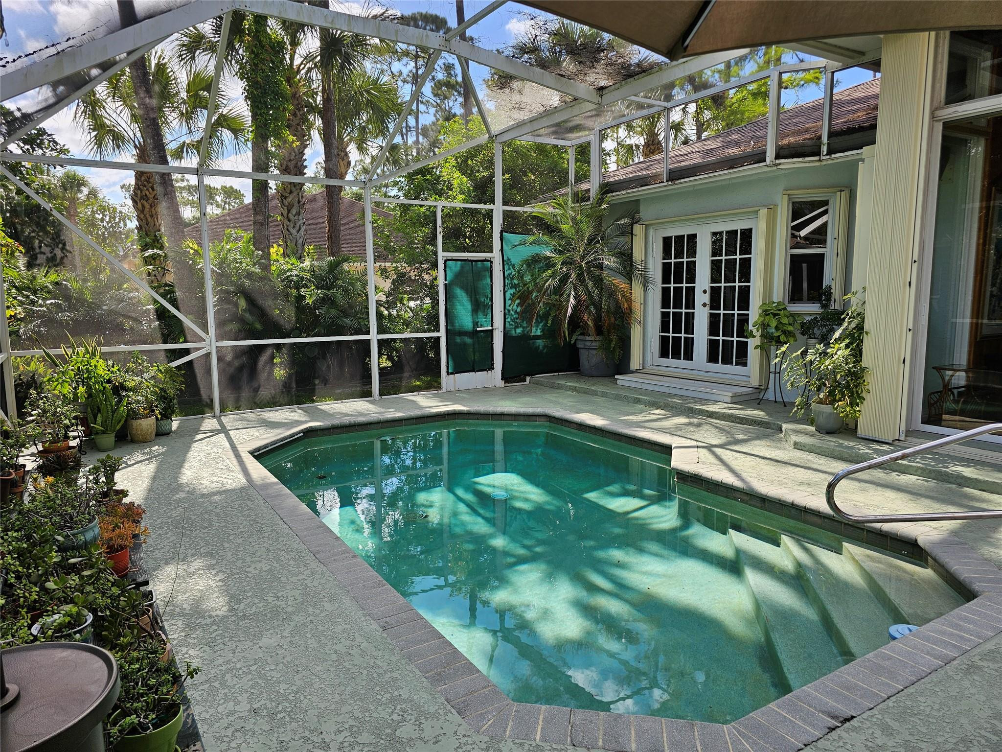 6963 Wilson Road West Palm Beach, FL 33413 - Photo 23 of 29 a view of a swimming pool with a patio