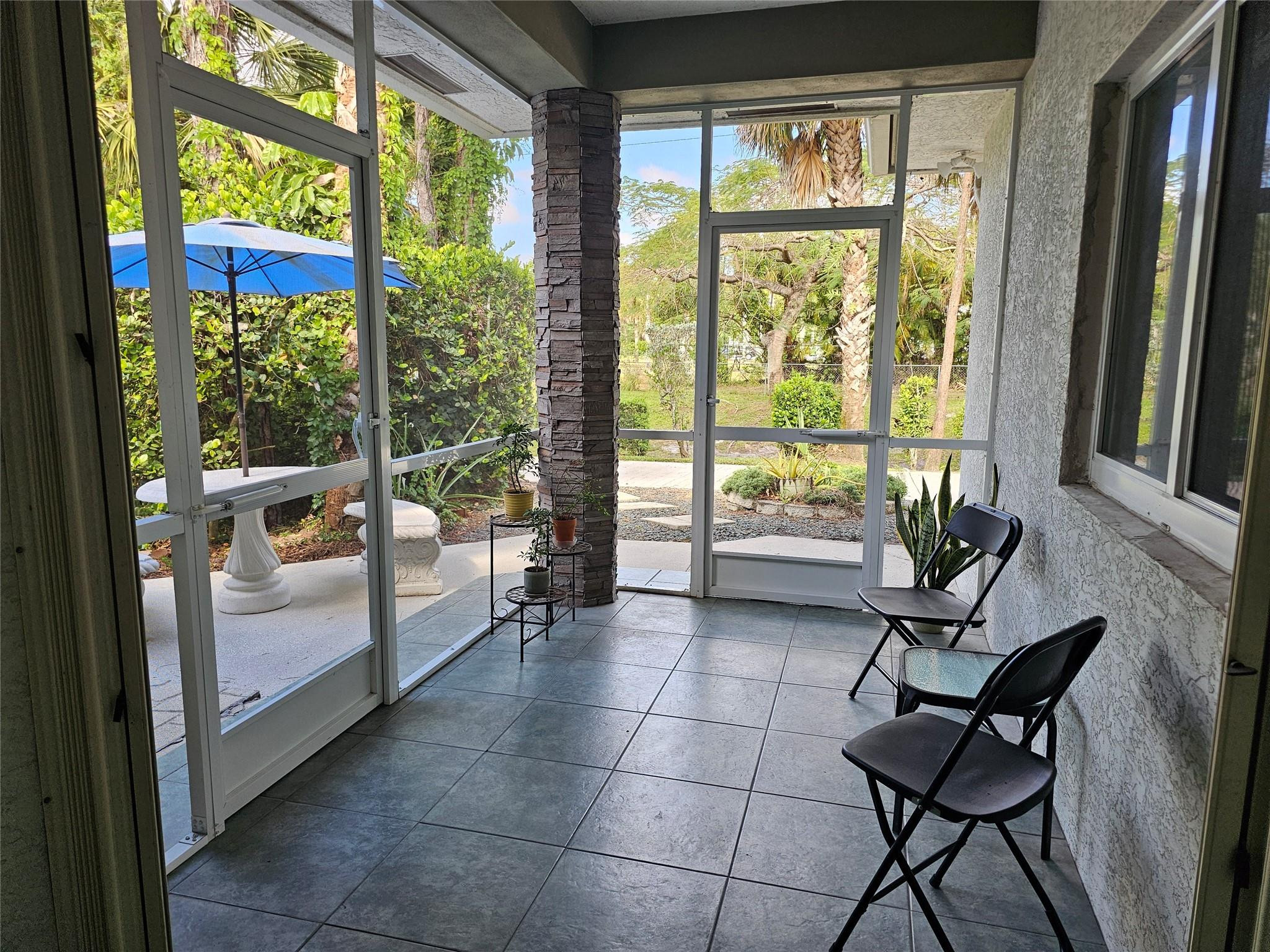 6963 Wilson Road West Palm Beach, FL 33413 - Photo 25 of 29 a living room with furniture and a window