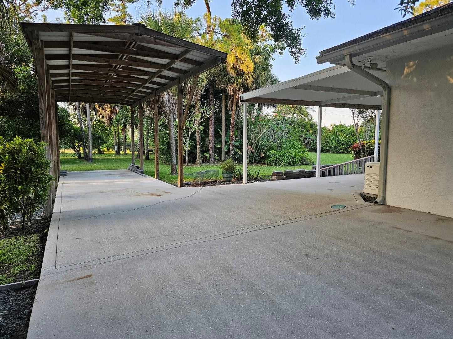 6963 Wilson Road West Palm Beach, FL 33413 - Photo 28 of 29 a view of porch with a table and chairs under an umbrella