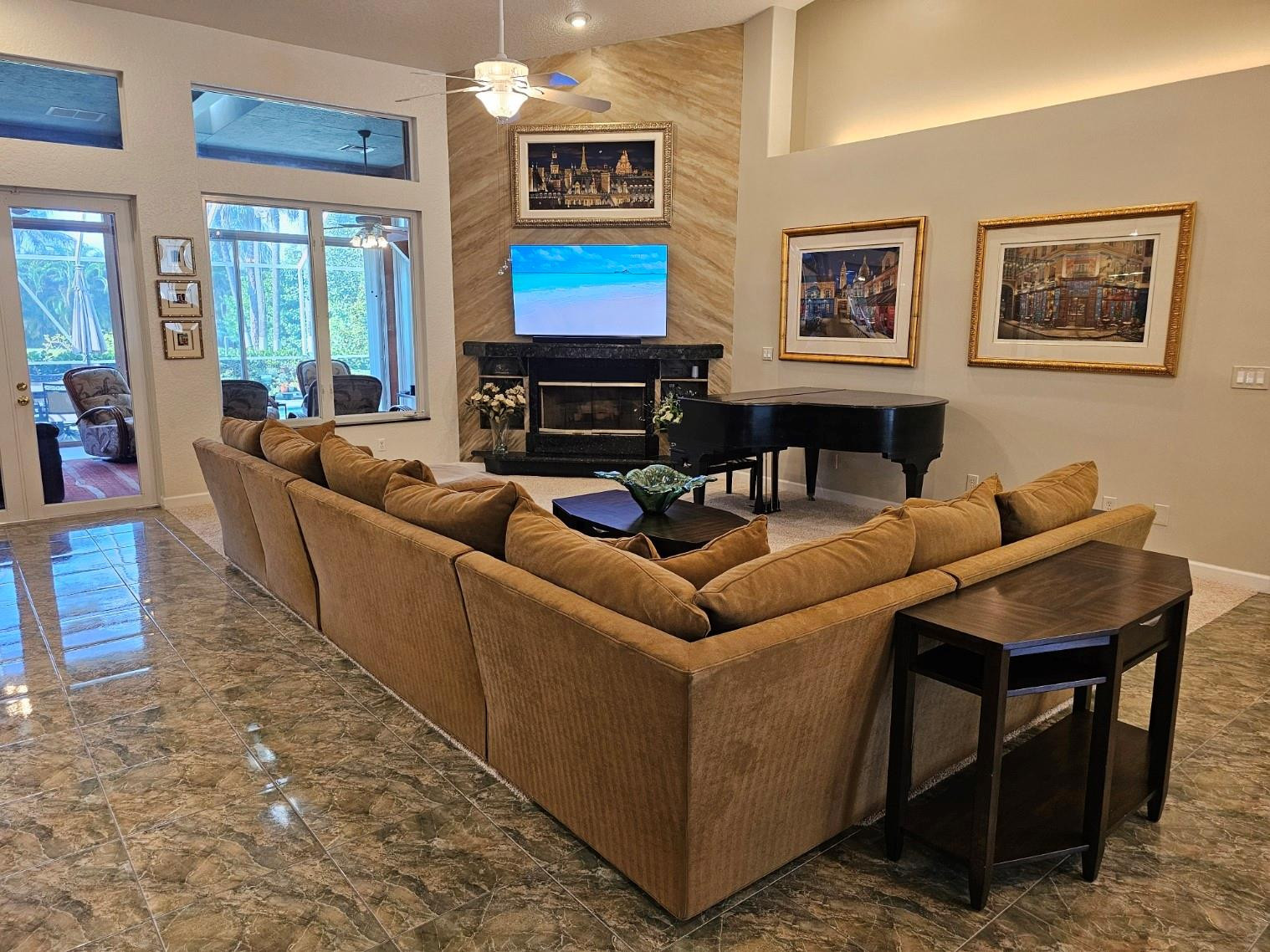 6963 Wilson Road West Palm Beach, FL 33413 - Photo 5 of 29 a living room with furniture a flat screen tv and a fireplace