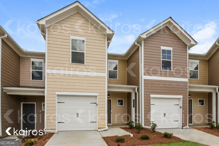 123 Dudley Way Cartersville, GA 30120 - Photo 2 of 16 a front view of a house with a parking space
