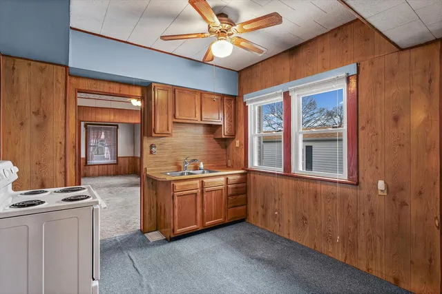 a kitchen with stainless steel appliances granite countertop a stove and a sink