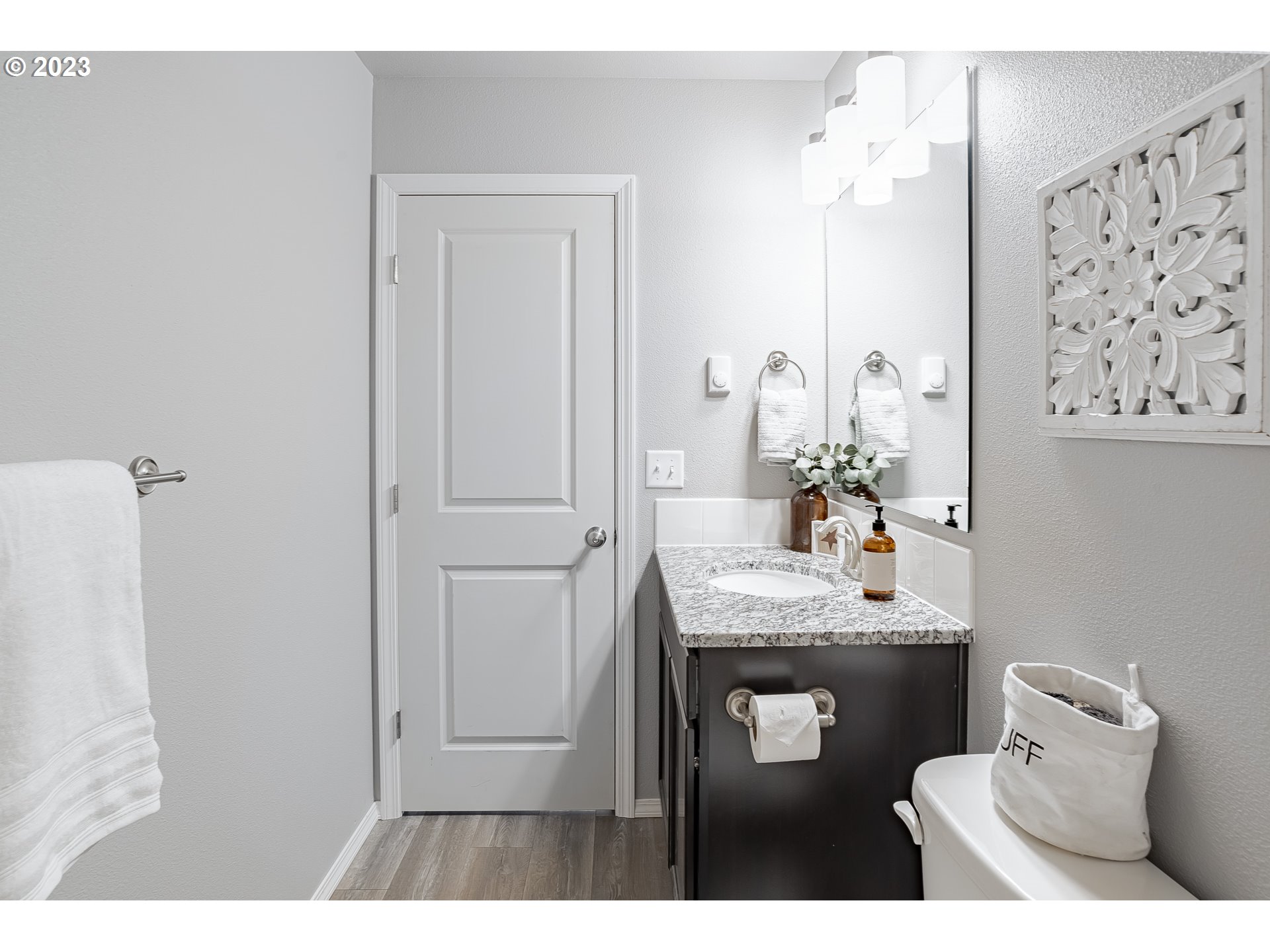501 Hooper Road Longview, WA 98632 - Photo 13 of 28 a bathroom with a granite countertop sink a toilet and mirror