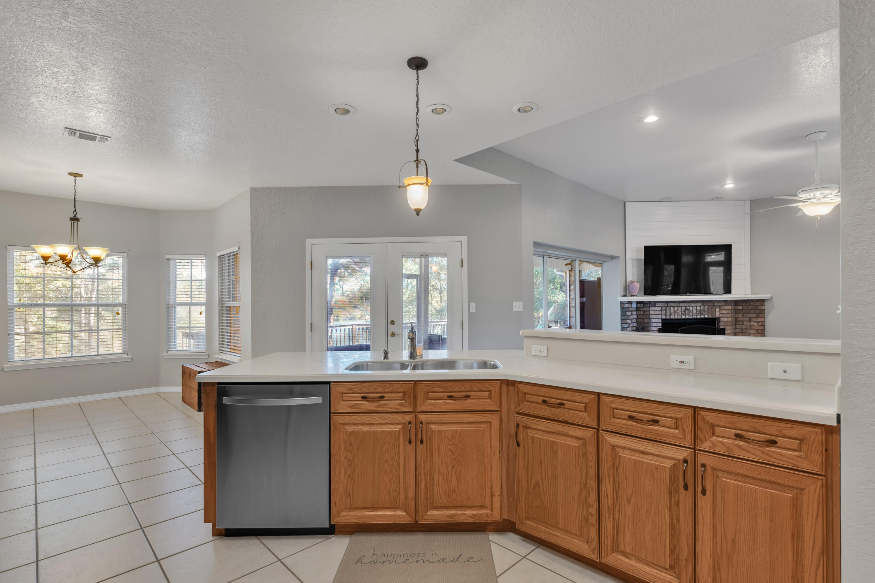 109 Oakcrest Drive Crestview, FL 32539 - Photo 12 of 35 a kitchen with stainless steel appliances granite countertop a sink and a wooden floors