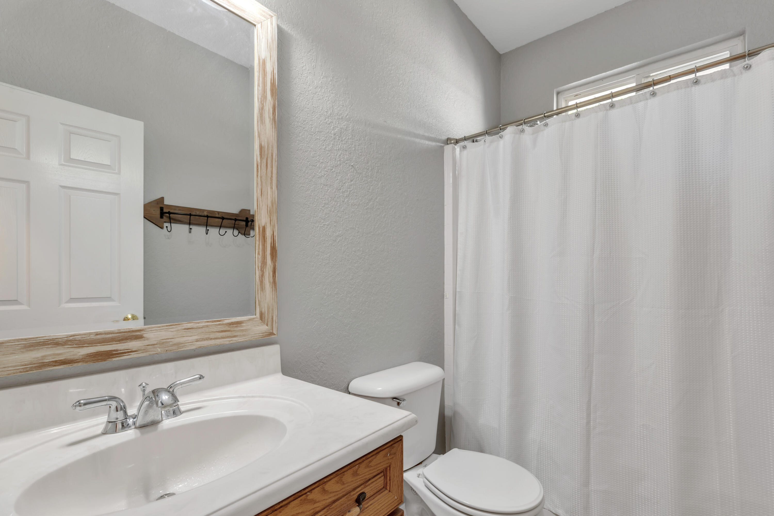 109 Oakcrest Drive Crestview, FL 32539 - Photo 20 of 35 a bathroom with a sink and a mirror
