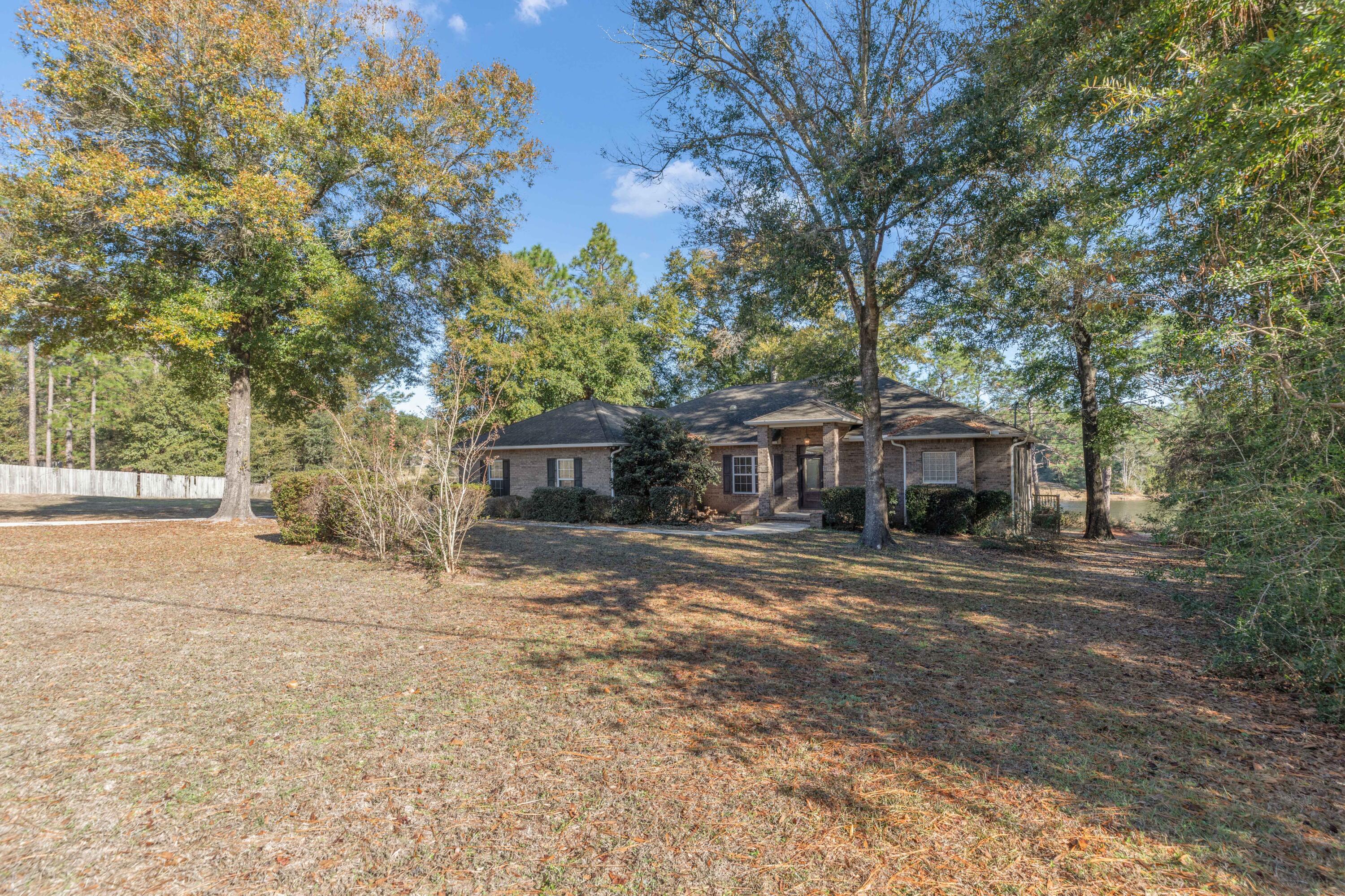 109 Oakcrest Drive Crestview, FL 32539 - Photo 2 of 35 a view of a house with a yard