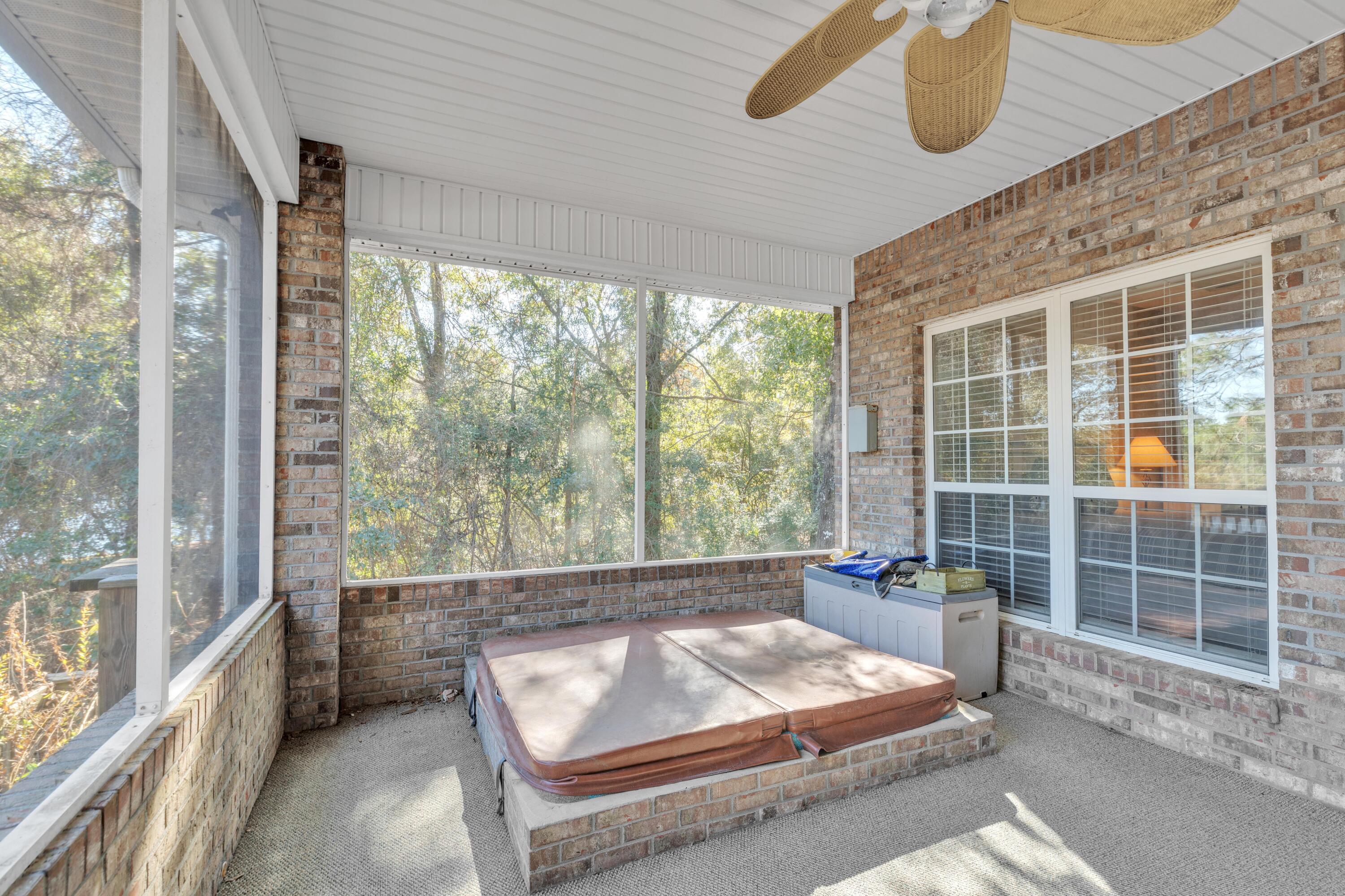109 Oakcrest Drive Crestview, FL 32539 - Photo 31 of 35 a living room with furniture and a large window