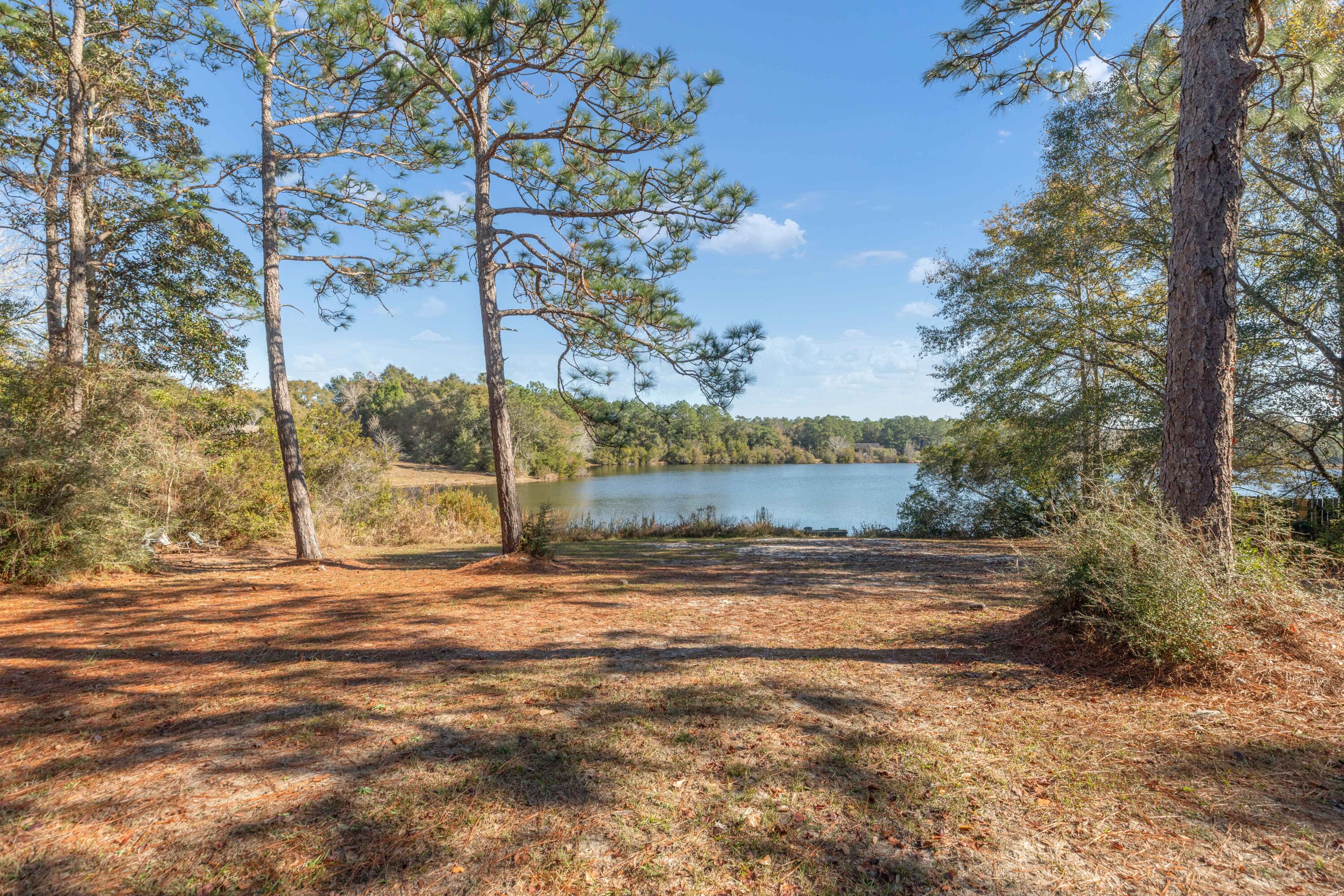 109 Oakcrest Drive Crestview, FL 32539 - Photo 33 of 35 a view of a yard with a tree