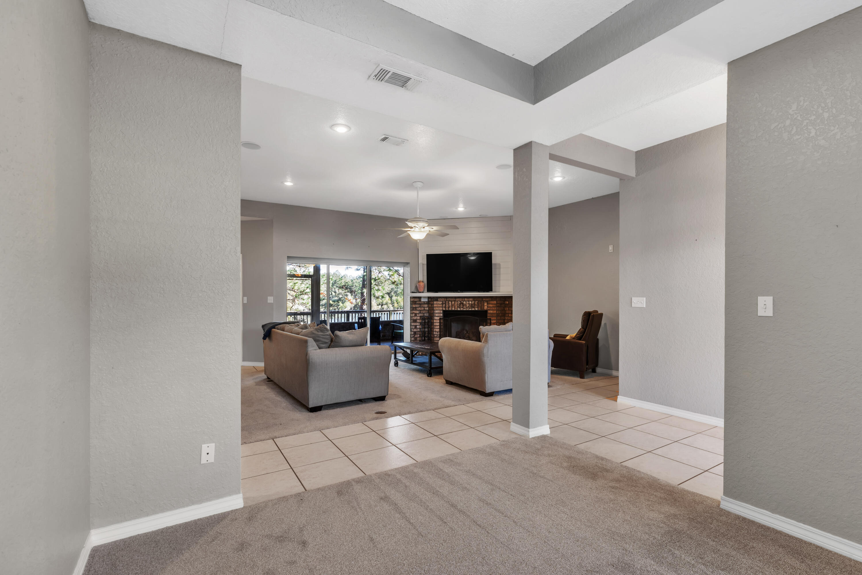 109 Oakcrest Drive Crestview, FL 32539 - Photo 5 of 35 a view of living room kitchen with stainless steel appliances furniture a rug and a window