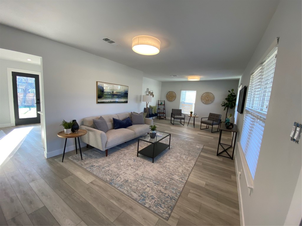 4901 Bandera Road Austin, TX 78721 - Photo 1 of 1 a living room with furniture and a couch