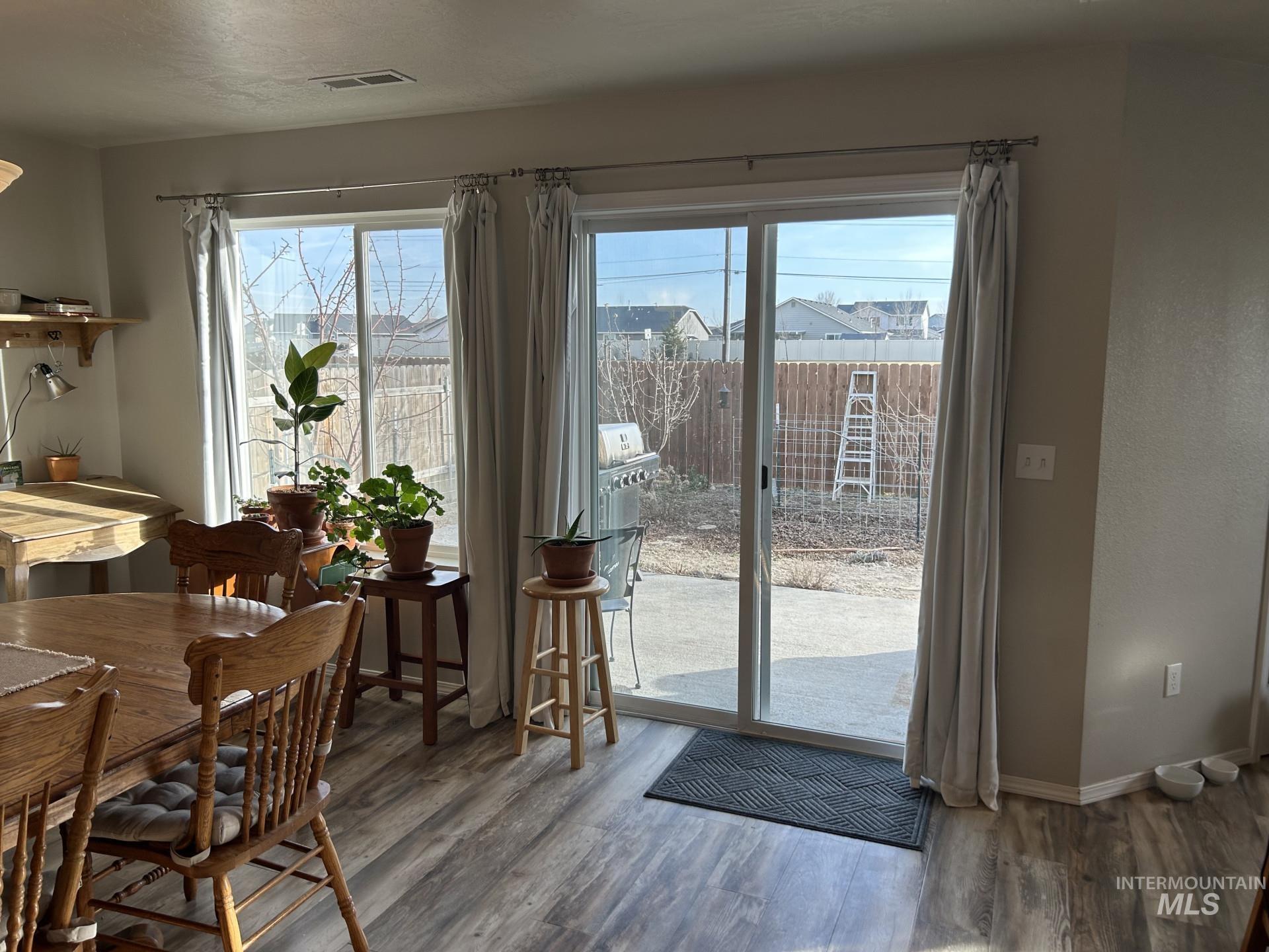 5614 Barkley Way Caldwell, ID 83607 - Photo 14 of 50 Dining area with wood finished floors and baseboards