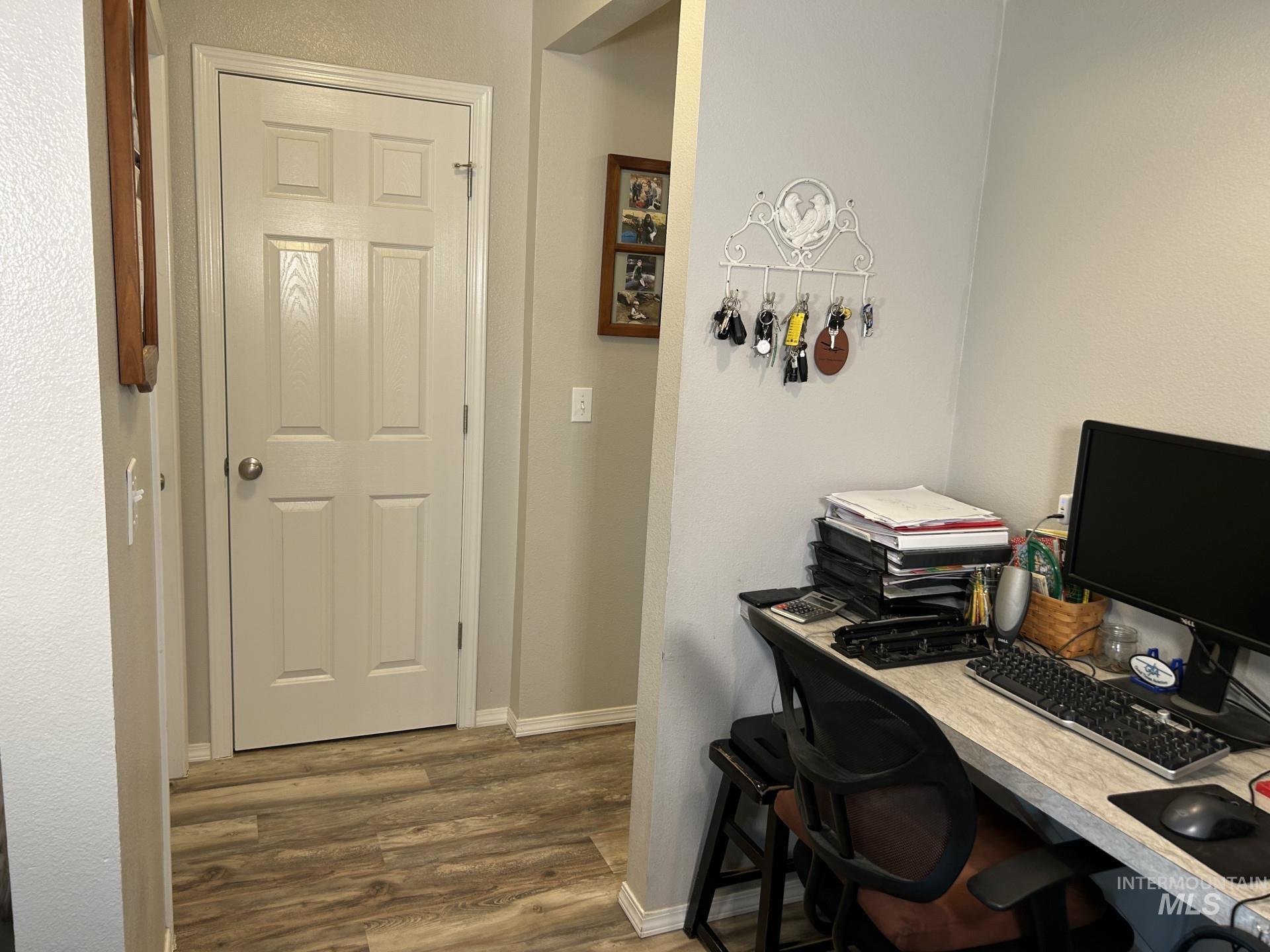 5614 Barkley Way Caldwell, ID 83607 - Photo 24 of 50 Home office featuring dark wood finished floors and a textured wall