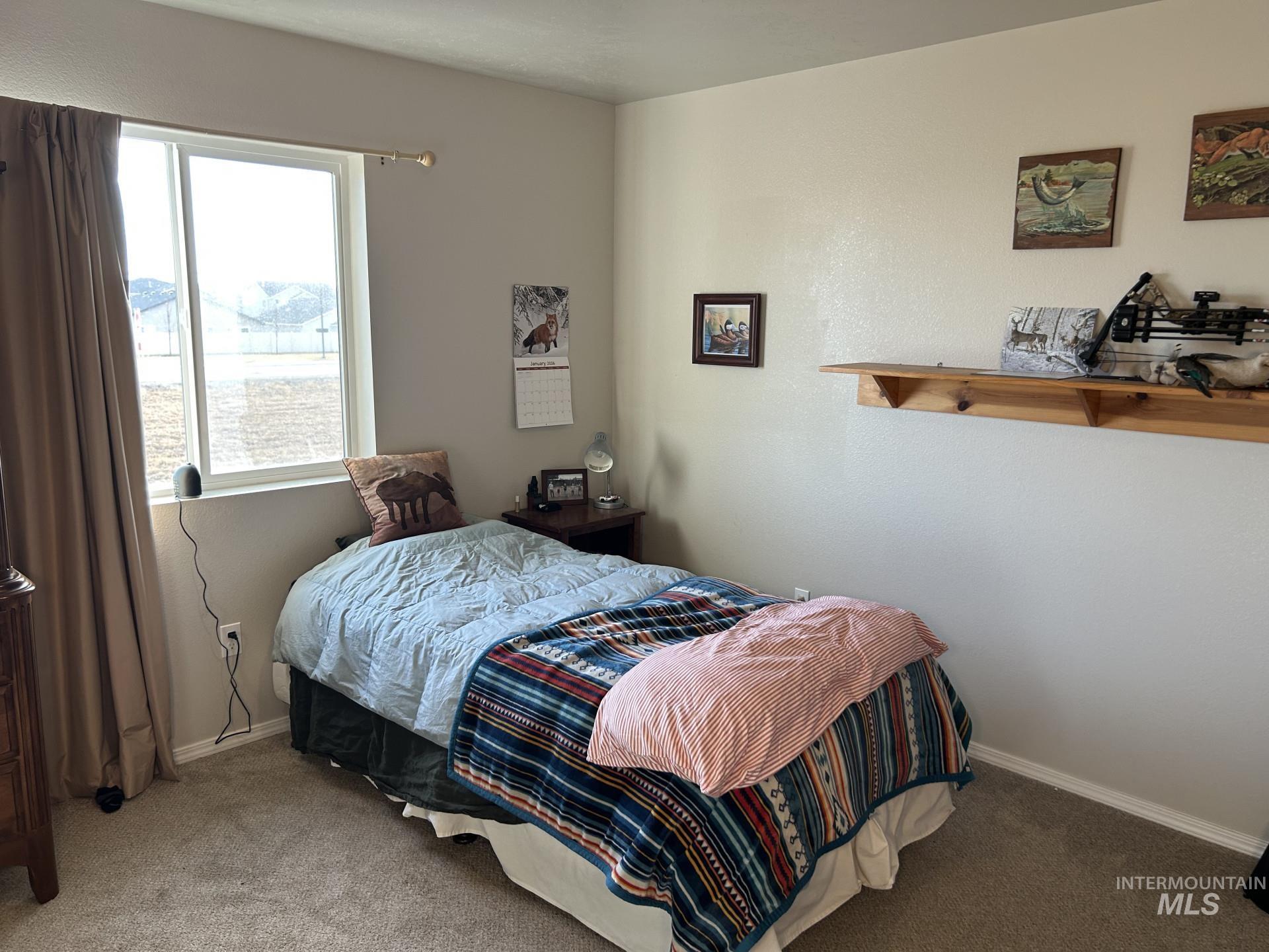 5614 Barkley Way Caldwell, ID 83607 - Photo 34 of 50 Bedroom with carpet and baseboards