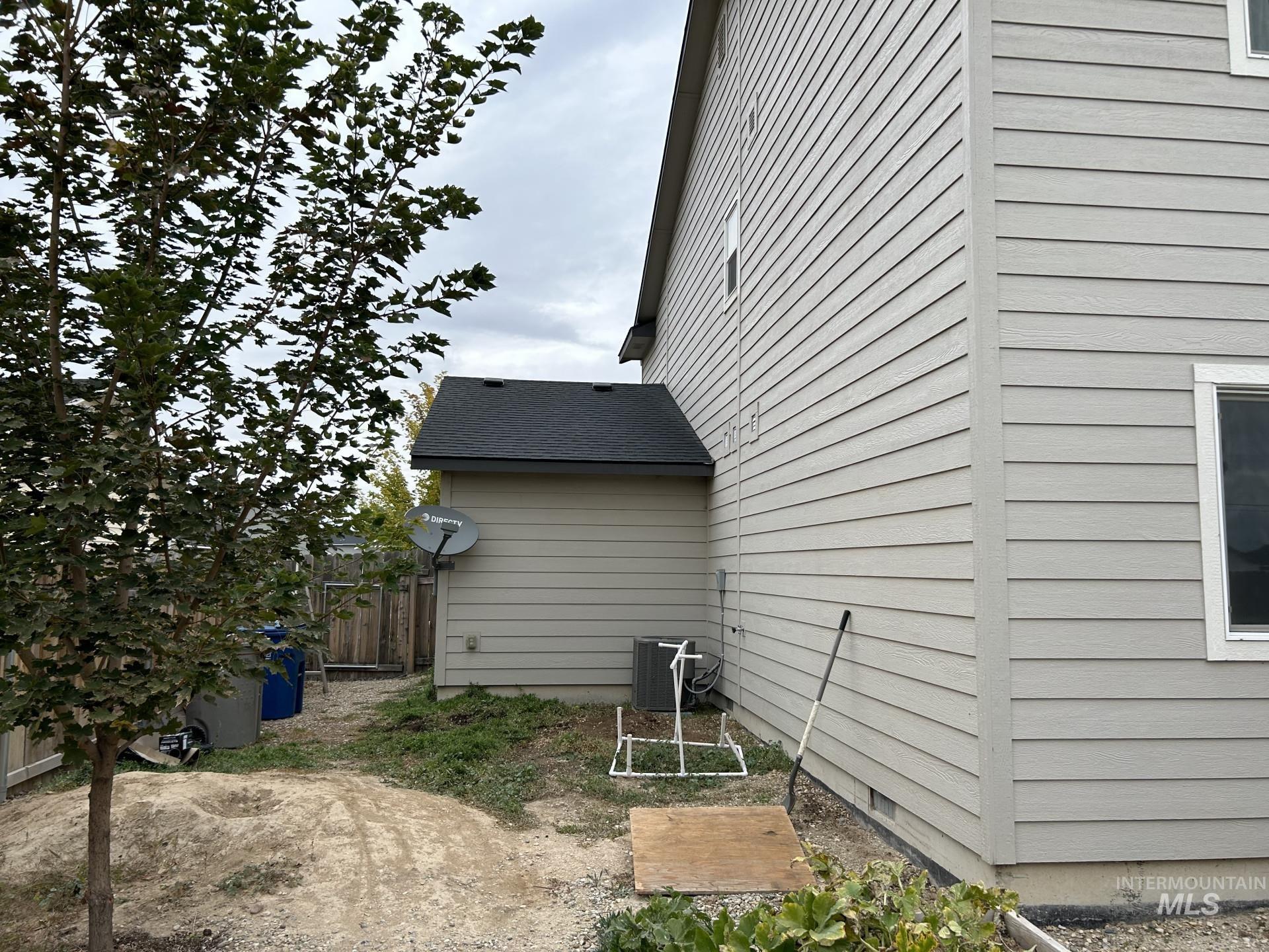 5614 Barkley Way Caldwell, ID 83607 - Photo 4 of 50 View of side of home with a central air condition unit